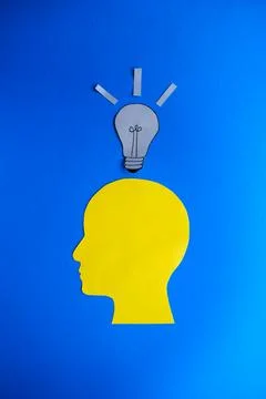 New Idea Concept with Human Head Silhouette and Lightbulb Stock Photos