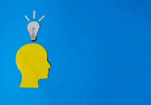 New Idea Concept with Human Head Silhouette and Lightbulb Stock-Fotos