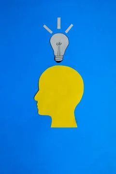 New Idea Concept with Human Head Silhouette and Lightbulb Stock-Fotos
