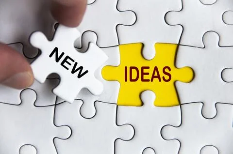 New ideas text on missing jigsaw puzzle. Business idea concept Stock Photos