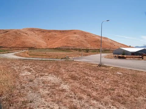 New industrial land in summer drought colours subdivided and roaded awaitin.. Stock Photos
