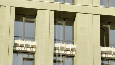 New Insulation Panels Cover Windows on a Rising High-Rise Facade Stock Footage 336936111