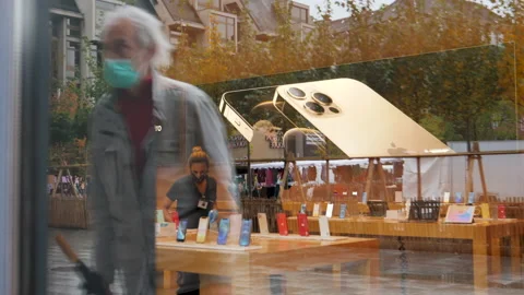 New iPhone 12 and iPhone 12 Pro on display during launch day Stock Footage 141773066