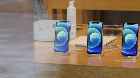New iPhone 12 and iPhone 12 Pro on display during launch day in Apple Store Stock Footage 141773129