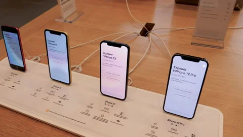 New iPhone 12 and iPhone 12 Pro on display during launch day next to SE and 11 Video stock 141773507