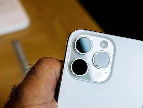 New iPhone 14 Pro Max with Triple Cameras in Male Hand Stock Photos