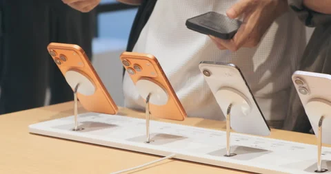 New iPhone 17 lineup on display at the Apple Store, close up. Shoppers test demo Stock Footage 322051623