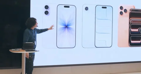 New iPhone 17 lineup presentation in Apple Store launch demo. Presenter speaking Stock Footage 322082581
