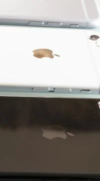 New iPhone 7 plus jet black compared with older.. Stock Photos
