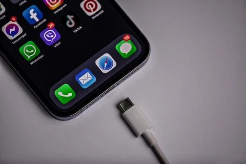 The new iPhone with the new type-c charger placed on a gray background, the new Stock Photos