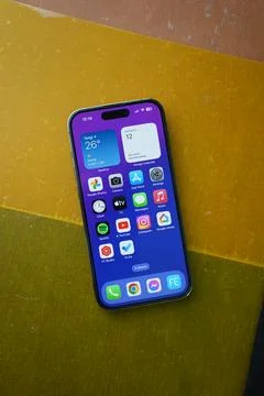 A new iPhone on top a yellow background Stock Photos