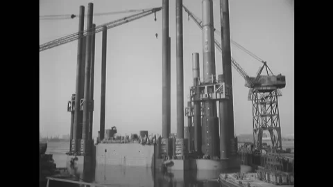 NEW JERSEY - 1955 - Dock cranes are used on the Texas Towers, followed by a tilt Stock Footage 331067979