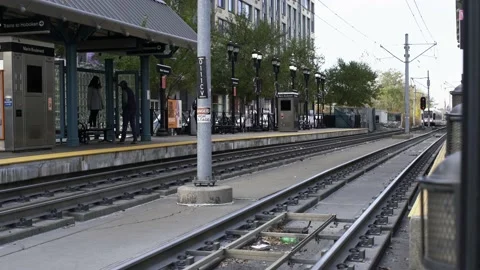 New Jersey Light Rail approaching Main Boulevard station in Jersey City Stock Footage 200661684