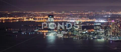 New jersey night panorama from new york city manhattan Stock Photos