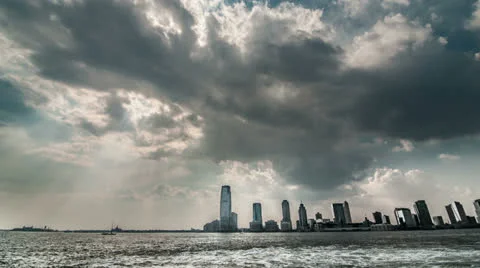 New Jersey Skyline - NJ Hudson River Water Boat Storm Clouds Skyscrapers Stock Footage