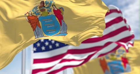 The New Jersey state flag waving along with the national flag of the US Stock Footage 196935368