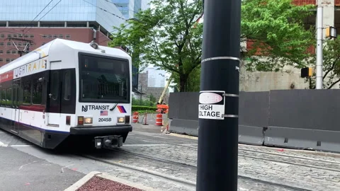 New Jersey Transit Light Rail Metro train passing through Jersey City Stock Footage 133465790