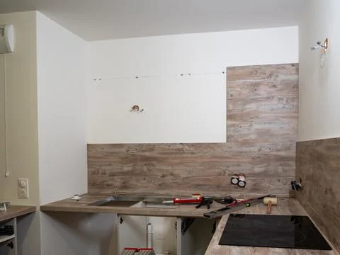 New kitchen - prepared for the assembly of kitchen furniture, cabinets, sink, Stock Photos