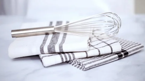 New kitchen towels with simple black pattern folded on marble counter. Stock Footage 93412715