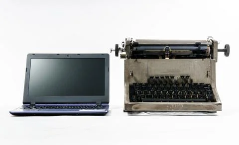 New laptop computer vs old vintage typewriter Stock Photos