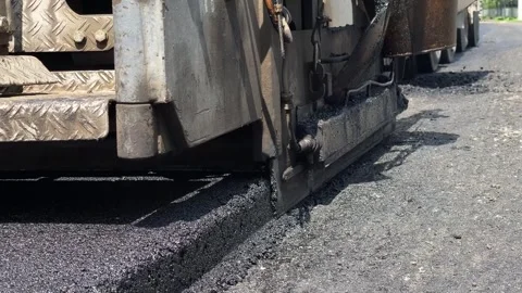 A new layer of asphalt is laid on the pavement Stock-Footage 247268368