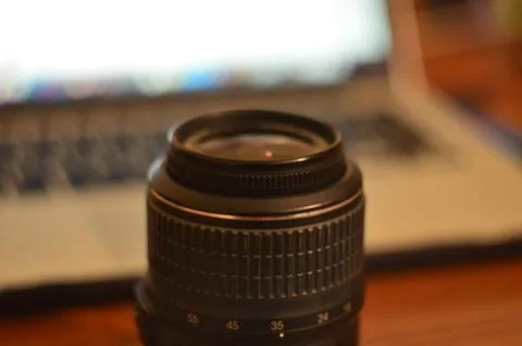 A new lens on the camera lies on the table Stock Photos