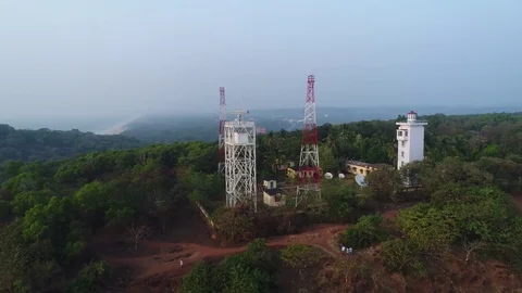 New lighthouse and navigation station near the ancient fort Aguada. Aerial view. Stock Footage 85087716