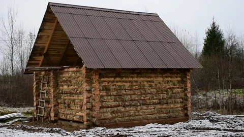 New log building, first snow Stock Footage 118908336
