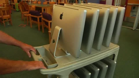 New Mac Computers delivered to school Stock Footage 11520627