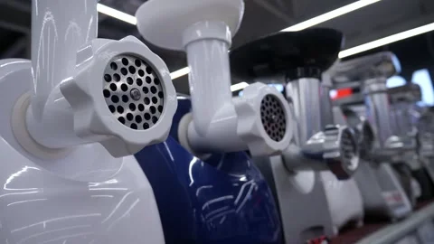 New meat grinders in a row on a store shelf. Stock-Footage 306616382