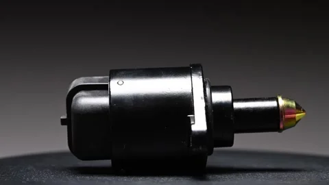A new mechanical reverse gear sensor in a car's gearbox. Rotating on a black Stock Footage 328911308