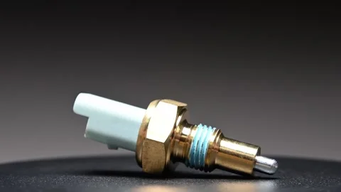 A new mechanical reverse gear sensor in a car's gearbox. Rotating on a black Stock Footage 328911409