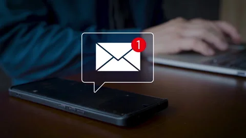 New message notification on smartphone screen with blurred businessman typin Stock Footage 319219243
