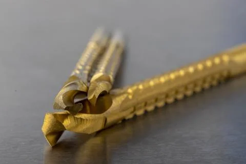 New metal drill with milling function. Accessories for a workshop mechanic on Stock Photos