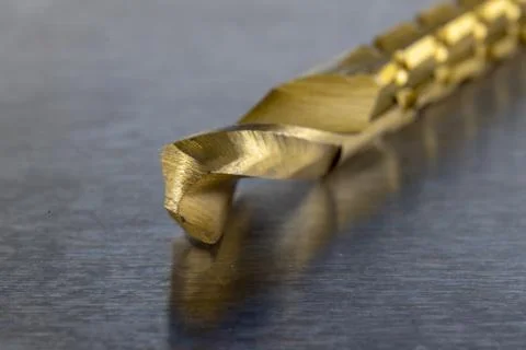 New metal drill with milling function. Accessories for a workshop mechanic on Stock Photos