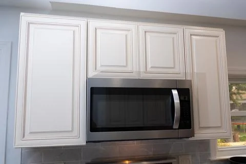 New microwave installed in new kitchen Stock Photos