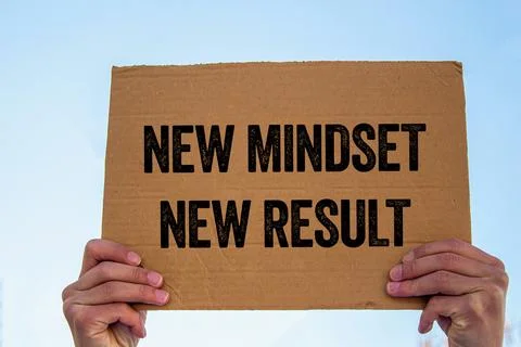 New mindset new result message written on cardboard sign. Conceptual new mi.. Stock Photos