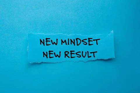New mindset new result message written on ripped torn paper piece on blue b.. Stock Photos