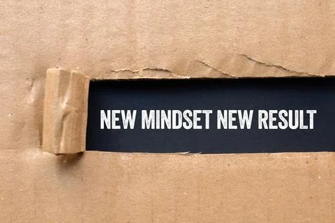 New mindset new result message written on ripped torn cardboard paper on bl.. Stock Photos