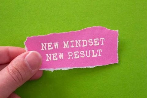 New mindset new result message written on ripped torn pink paper piece on g.. Stock Photos