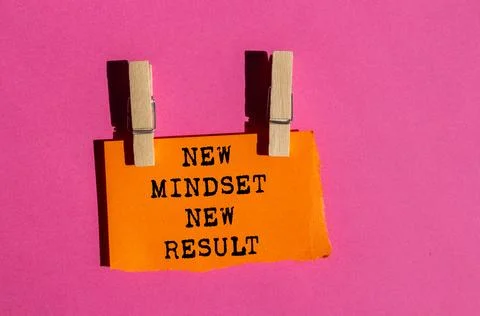 New mindset new result message written on ripped torn orange paper on pink .. Stock Photos