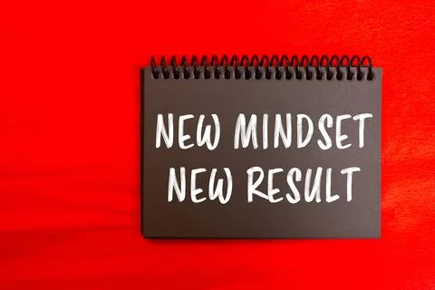 New mindset new result message written on black notebook page on red backgr.. Stock Photos