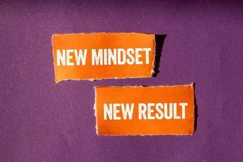 New mindset new result message written on ripped torn orange paper pieces o.. Stock Photos