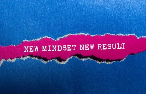 New mindset new result message written on ripped torn blue paper on pink ba.. Stock Photos