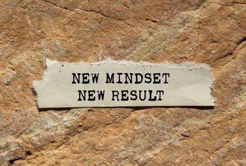 New mindset new result message written on ripped torn  paper on stone backg.. Stock Photos