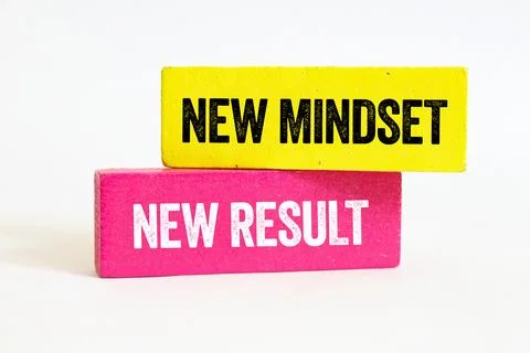 New mindset new result message written on wooden blocks on white background.. Stock Photos