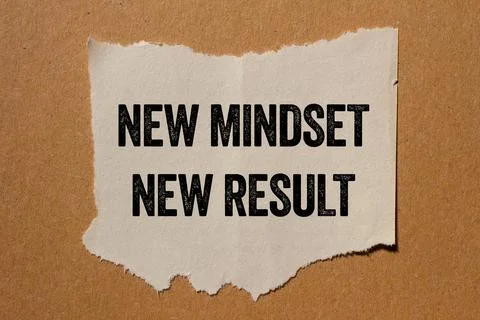 New mindset new result message written on ripped torn paper piece on brown .. Stock Photos
