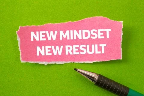 New mindset new result message written on ripped torn pink paper piece on g.. Stock Photos