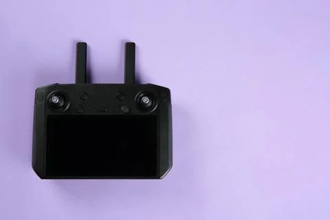 New modern drone controller on lilac background, top view. Space for text Stock Photos