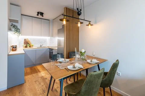 New modern kitchen with table served for dinner. New home. Interior photograp Stock Photos